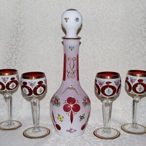 Antique cased Bohemian ruby glass decanter set
